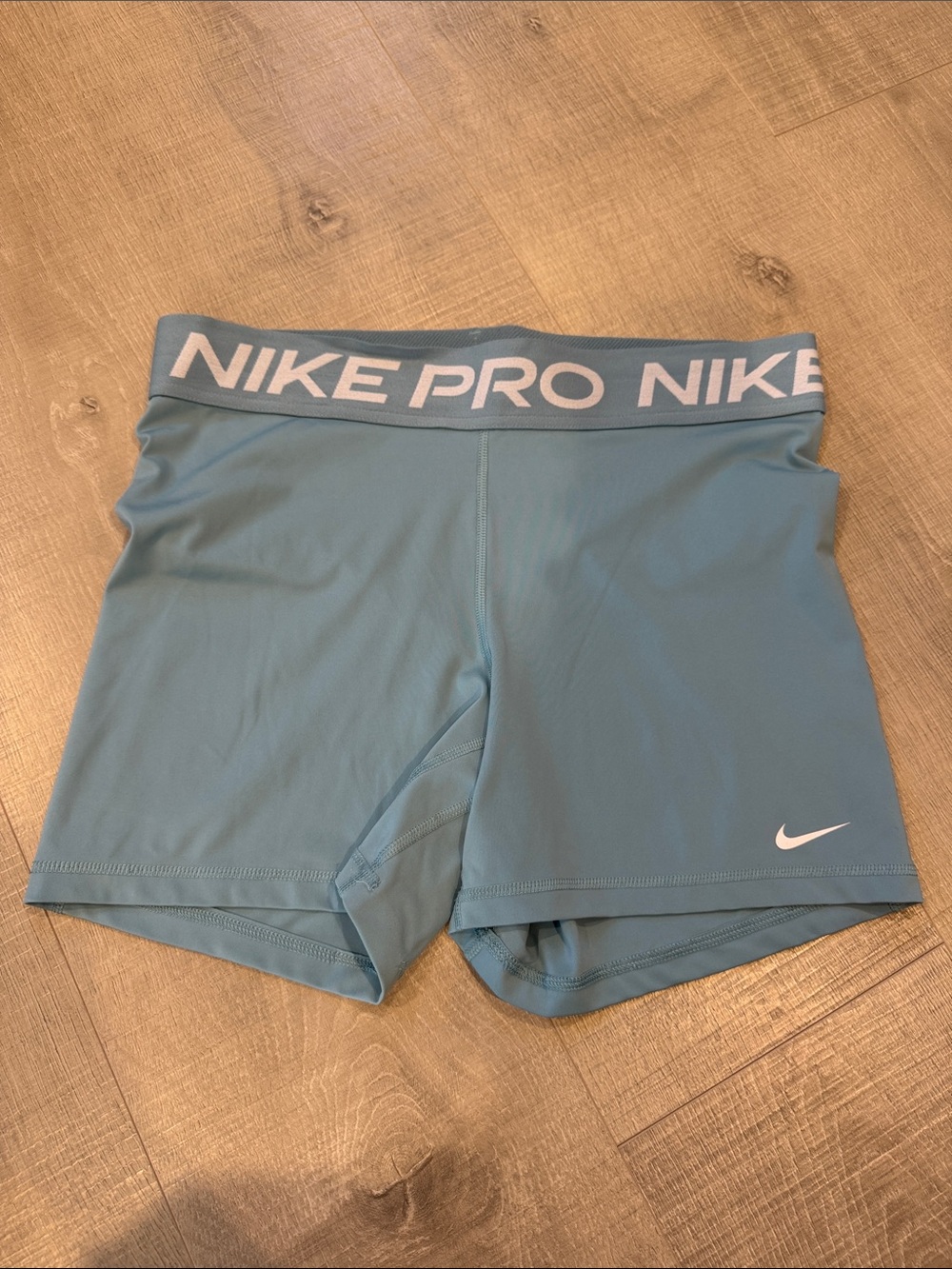 Nike Pro Women’s Teal Performance Shorts with White Logo